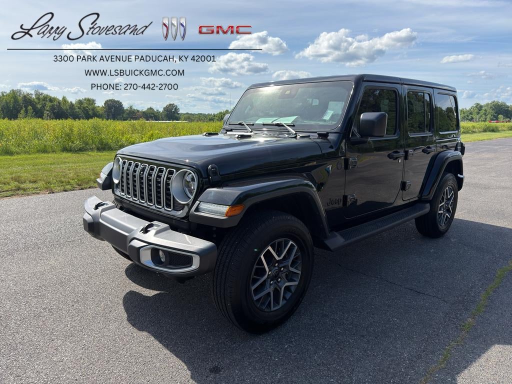 2025 Jeep Wrangler 4-Door Sahara 4x4 in Black — front three-quarter view