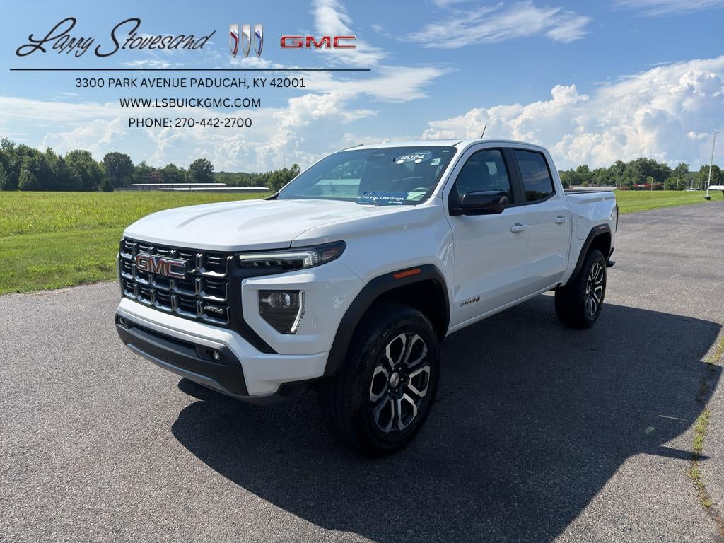 2024 GMC Canyon AT4 in Summit White — front three-quarter view
